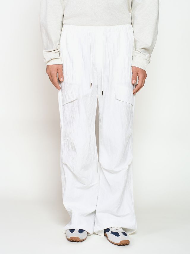 Брюки из жатой ткани с драпировкой