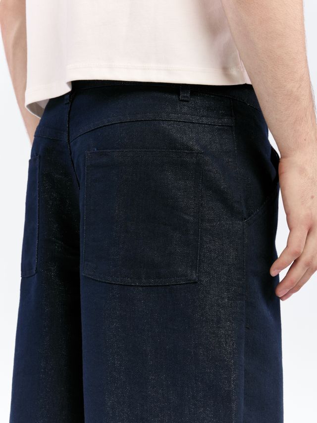 Джинсы с люрексом и контрастной пуговицей