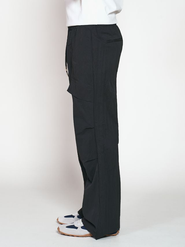 Брюки из жатой ткани с драпировкой