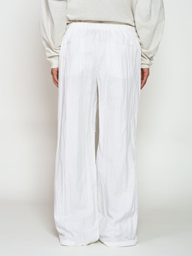 Брюки из жатой ткани с драпировкой