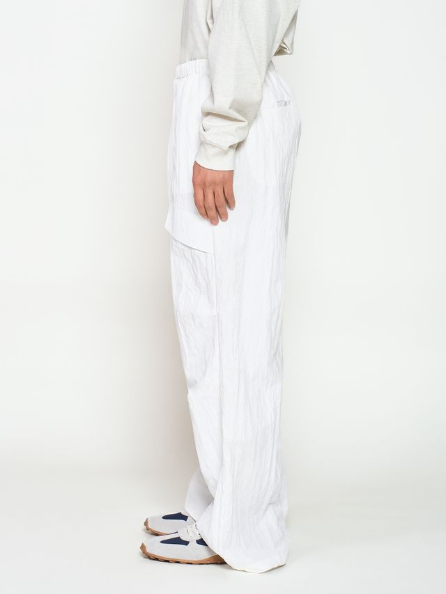 Брюки из жатой ткани с драпировкой