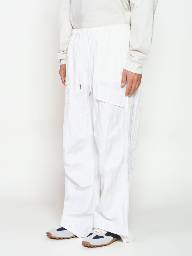 Брюки из жатой ткани с драпировкой