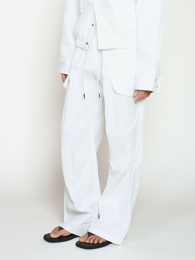 Брюки из жатой ткани с драпировкой