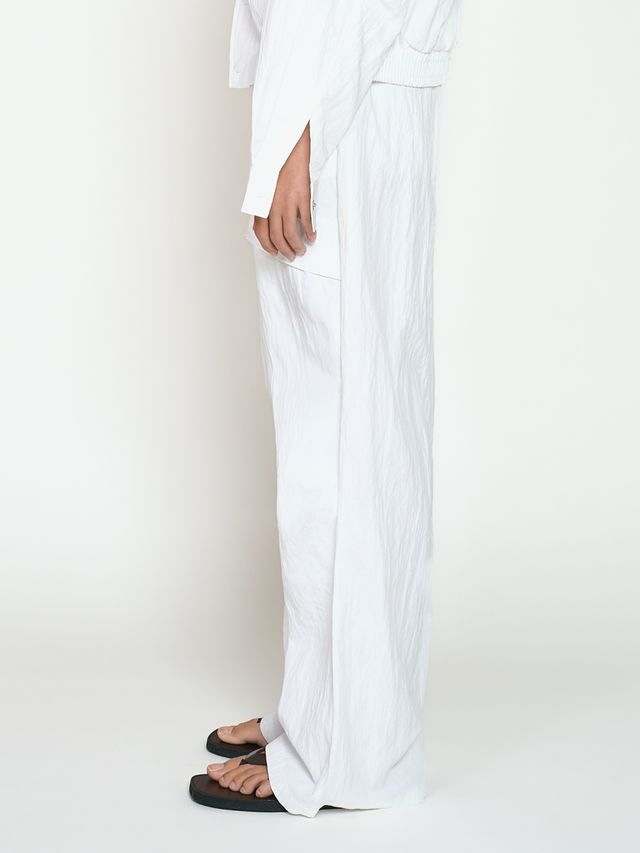 Брюки из жатой ткани с драпировкой